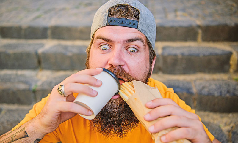 man eats junk food